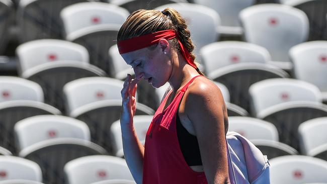 Kristina Mladenovic walks from the court after retiring early from her match against Ellen Perez.