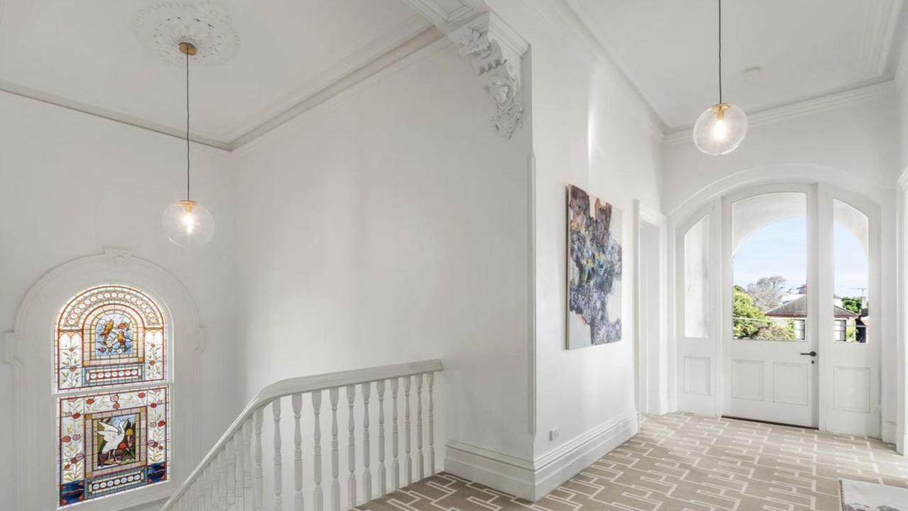 A sympathetic restoration has revived the home’s original elegance, with ornate ceiling roses, cornices and period features now proudly on show.