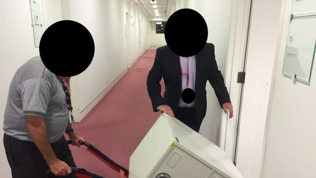 ASIO agents raid the ABC office.