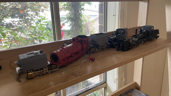 The homeowner was able to retrieve some of the model trains from the damaged room. Picture: Jack Colantuono