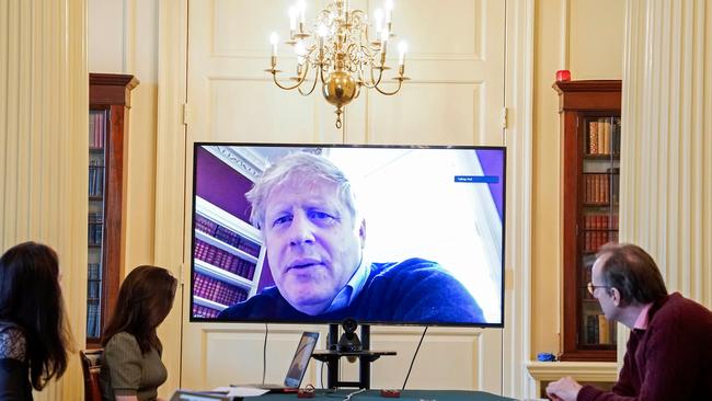 Boris Johnson on a screen as he remotely chairs the morning novel coronavirus COVID-19 meeting by video link, in Downing Street in central London. Picture: 10 Downing Street/AFP