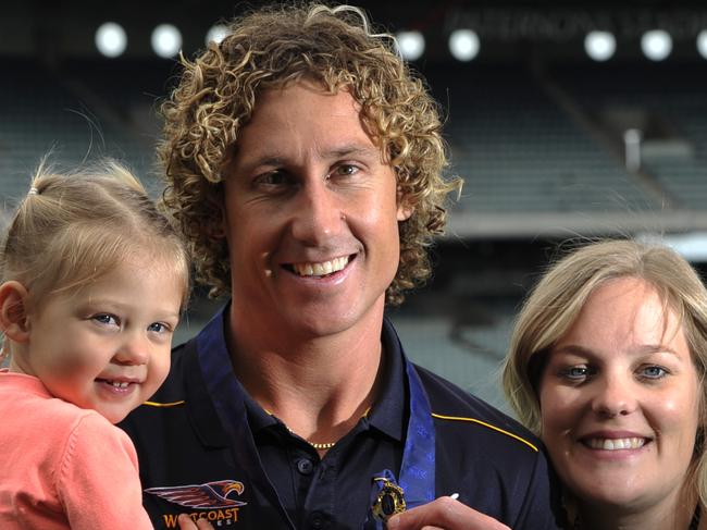 Eagle Eagle Matthew Priddis has walked away as the 2014 Brownlow Medalist. pictured is Matthew with his wife Ashleigh and daughter Nala (1)