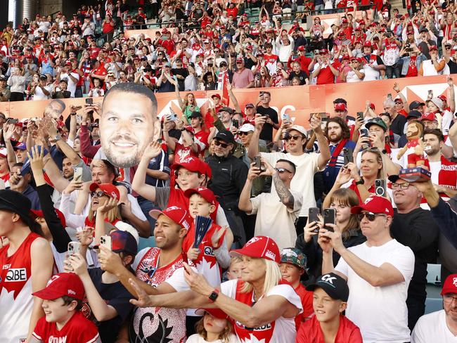 DAILY TELEGRAPH AUGUST 27, 2023. Swans crowd cheering for retired champion Lance Franklin during a lap of honour with his wife Jesinta and their children Rocky and Tullulah at half-time of the Sydney Swans Round 24 match against Melbourne at the SCG. Picture: Jonathan Ng