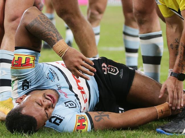 SYDNEY, AUSTRALIA - MARCH 27:  Sione Katoa of the Sharks is assisted after sustaining an injury during the round three NRL match between the Parramatta Eels and the Cronulla Sharks at Bankwest Stadium on March 27, 2021, in Sydney, Australia. (Photo by Matt King/Getty Images)