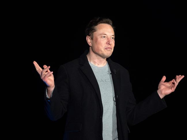 (FILES) In this file photo taken on February 10, 2022 Elon Musk gestures as he speaks during a press conference at SpaceX's Starbase facility near Boca Chica Village in South Texas. - Twitter owner Elon Musk on March 17, 2023 put out word that he will make public the long-secret algorithm for recommending tweets. The code used for recommending the posts suggested to users will become "open source" at the end of March, Musk said in a tweet of his own. (Photo by JIM WATSON / AFP)