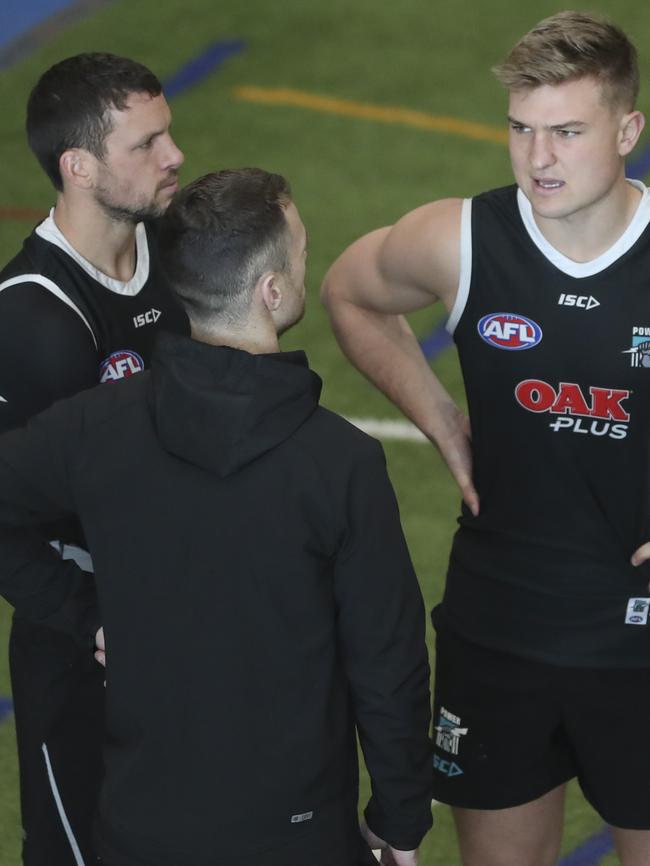 Travis Boak, Ollie Wines and Robbie Gray deep in discussions at Port Adelaide training on Friday. Picture SARAH REED