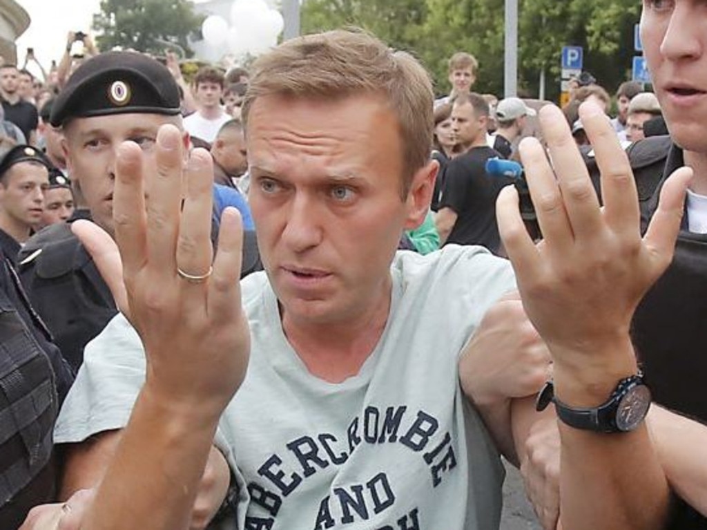 Russian opposition leader Alexei Navalny is led away by police. Picture: Supplied