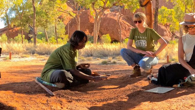 Maruku Arts tours teach tourists about the Indigenous rock art seen on Uluru. Picture: Chantelle Francis / GoPro