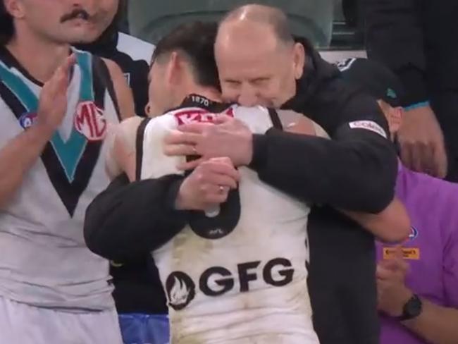 Port Adelaide coach Ken Hinkley hugs player Zak Butters on the siren of todays match with St Kilda. Picture: Fox Sport