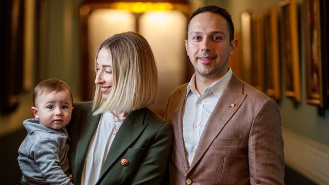 Arman Abrahimzadeh, right, with his wife Genevieve Lewis and their son Raphael at the Adelaide Town Hall. Picture Matt Turner.