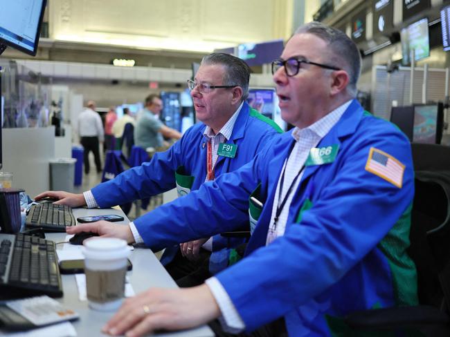 NEW YORK, NEW YORK - APRIL 30: Traders work on the floor of the New York Stock Exchange during morning trading on April 30, 2025 in New York City. Stocks fell sharply on the final trading opening day of April after data showed the U.S. economy shrunk in the first quarter, as a series of trade-focused policy moves by President Donald Trump weighed on business sentiment.   Michael M. Santiago/Getty Images/AFP (Photo by Michael M. Santiago / GETTY IMAGES NORTH AMERICA / Getty Images via AFP)