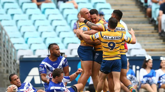 SYDNEY, AUSTRALIA - MARCH 24: Blake Ferguson of the Eels celebrates with teammates after scoring a try during the round two NRL match between the Canterbury Bulldogs and the Parramatta Eels at ANZ Stadium on March 24, 2019 in Sydney, Australia. (Photo by Jason McCawley/Getty Images)