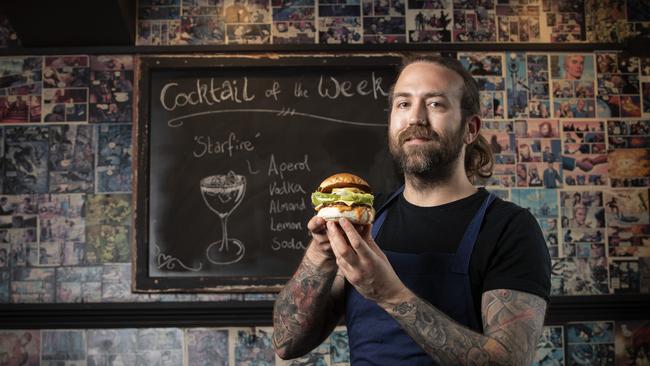 The Mayfair Bar head chef Jarrod Sorbian with a Vegan West Coast Burger at Sandy Bay. Picture: Chris Kidd