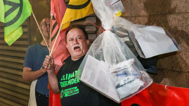 Protester Joe Zammit, 68, leaves the Magistrates Court after being arrested as part of an Extinction Rebellion protest on the Westgate Bridge. Picture: NCA NewsWire / Ian Currie