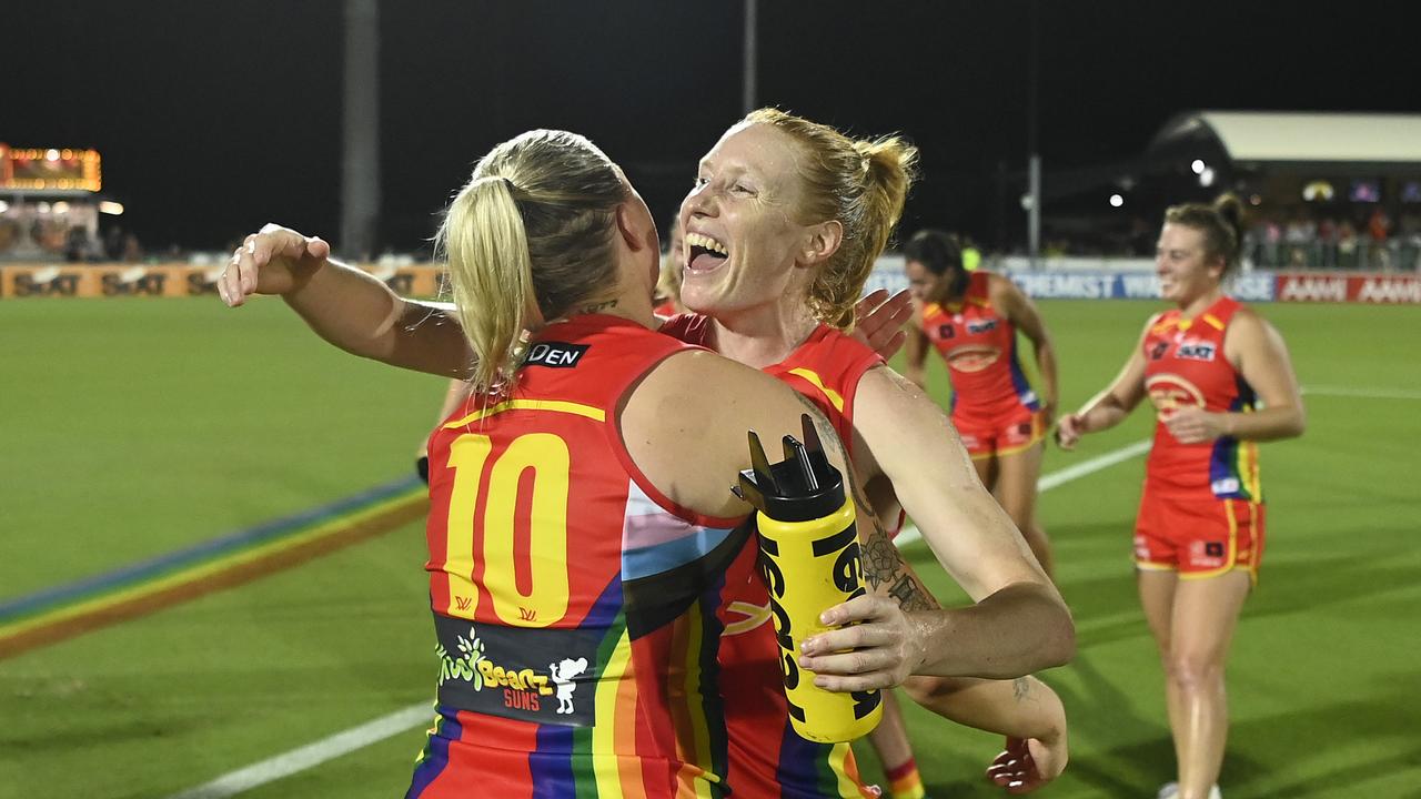 MACKAY, AUSTRALIA – NOVEMBER 03: The Suns celebrate after winning the round 10 AFLW match between Gold Coast Suns and Essendon Bombers at Great Barrier Reef Arena, on November 03, 2023, in Mackay, Australia. (Photo by Ian Hitchcock/AFL Photos/via Getty Images)