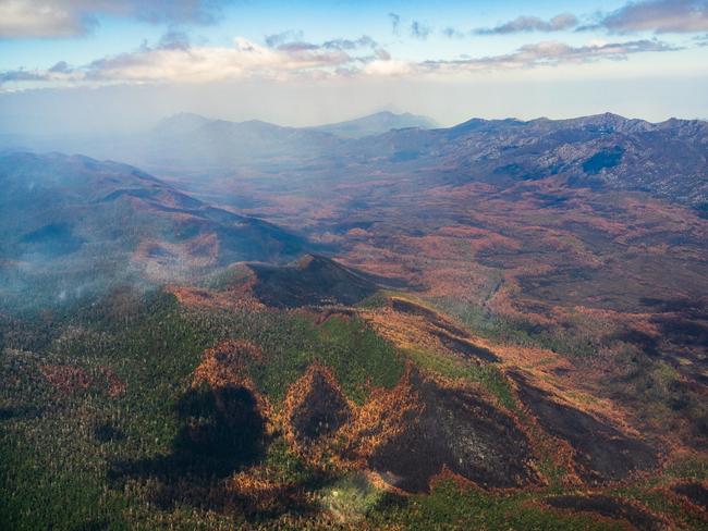 2019 Tasmanian bush fires. Gordon Range, Vale of Rasselas and the distant Denison Range, Gell River Fire - at Southwest National Park. . Picture - LUKE TSCHARKE / PAR AVION