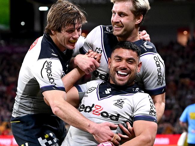 BRISBANE, AUSTRALIA - AUGUST 19: David Nofoaluma of the Storm celebrates scoring a try during the round 23 NRL match between the Brisbane Broncos and the Melbourne Storm at Suncorp Stadium, on August 19, 2022, in Brisbane, Australia. (Photo by Bradley Kanaris/Getty Images)