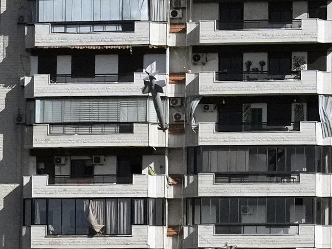 The terrifying moment the missile hit the building. Picture: AP Photo/Bilal Hussein