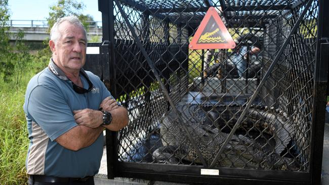 Senior Wildlife Officer Tony Frisby of the Department of Environment, Science and Innovation with a 3.6-metre saltwater crocodile at Cattle Creek on the Bruce Highway between Townsville and Ingham overnight Friday. Picture: Cameron Bates