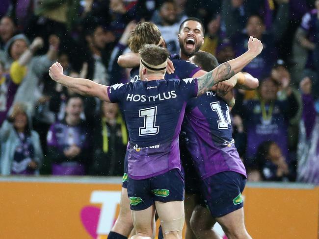 Melbourne Storm players celebrate after beating the Raiders in the 2016 finals series. Picture: George Salpigtidis