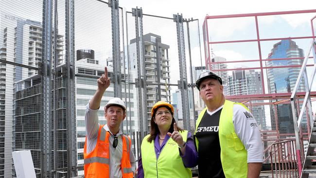 Industrial Relations Minister Grace Grace (middle) with CFMEU President Royce Kupsch (right). Also pictured is Brad Doherty with Sunland who is not connected to the case. Picture: Sarah Marshall