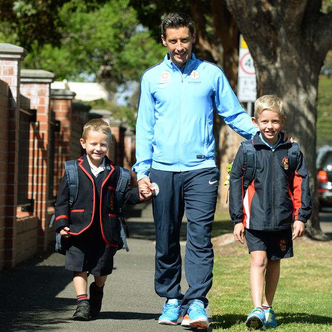 Tian, 5, Robert Koren and Nal, 8, for Walk to School Month at Brighton Grammar. Picture: Kris Reichl