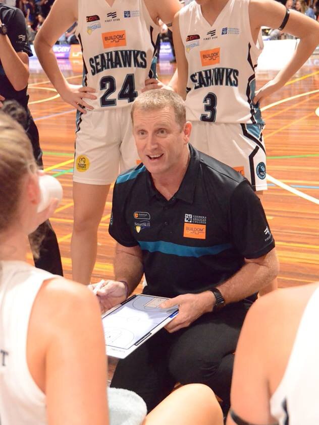 North Gold Coast Seahawks coach Robert Sleaford relays a maeesage to his troops. Picture: Fan Fair