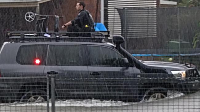 Queensland police officers rescued an elderly resident and their wheelie walker in a police four-wheel-drive after heavy rain caused flooding in Campbell Street, Klarwein Close and Whittaker Close in Gordonvale. Picture: Brendan Radke