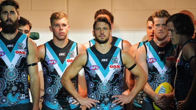 Travis Boak. middle, prepares to lead the Power onto the field ahead of its win against Richmond at Adelaide Oval on June 8. Picture: Daniel Kalisz/Getty Images