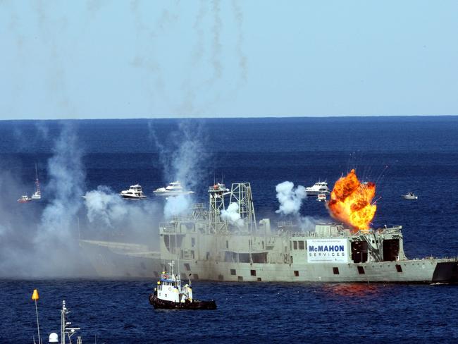 Sixteen charges were detonated to scuttle the decommissioned RAN frigate ship HMAS Adelaide, 1.8km off Avoca Beach.