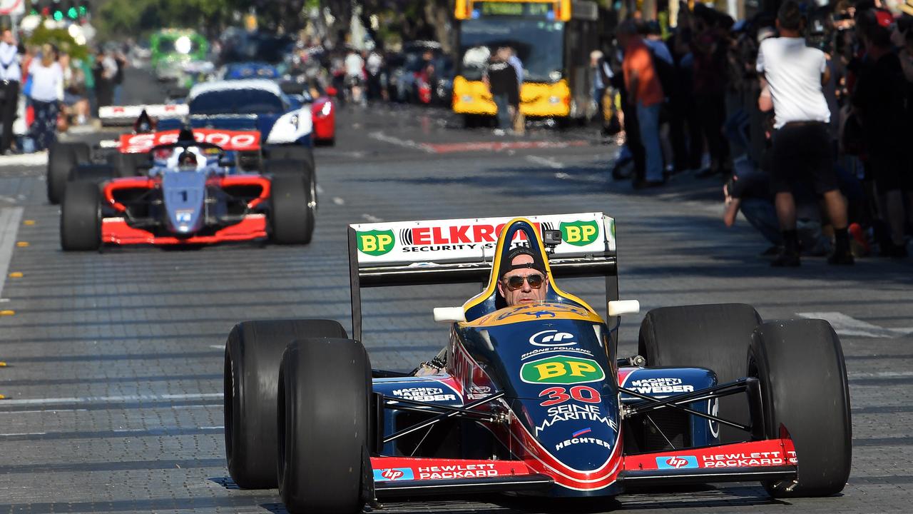 Race cars head down Wakefield Street through Victoria Square for the Adelaide Motorsport Festival’s Peak Hour of Power. Picture: Tom Huntley