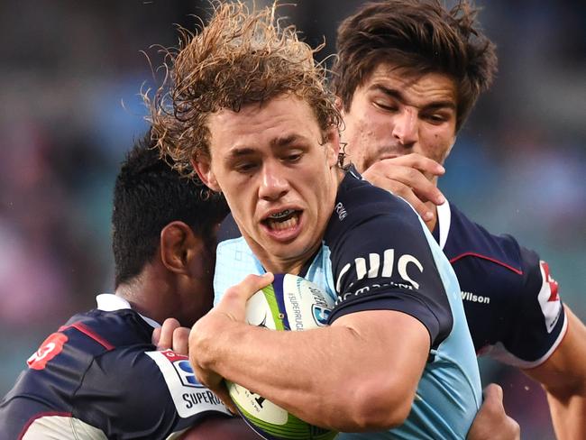 Ned Hanigan (centre)of the Waratahs is tackled by Lopeti Timani (left) and Amanaki Mafi of the Rebels during the Round 13 Super Rugby match between the NSW Waratahs and the Melbourne Rebels at Allianz Stadium in Sydney, Sunday, May 21, 2017. (AAP Image/Paul Miller) NO ARCHIVING, EDITORIAL USE ONLY