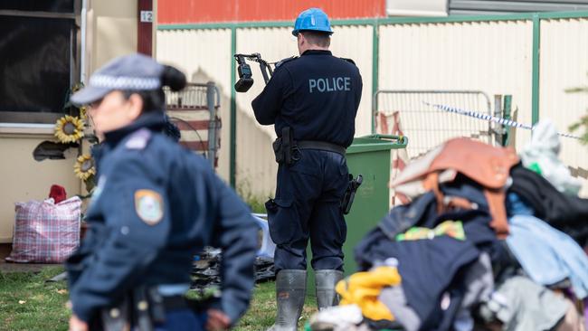 Police investigators at the Utzon Rd, Cabramatta West house where a man perished. Picture: James Gourley