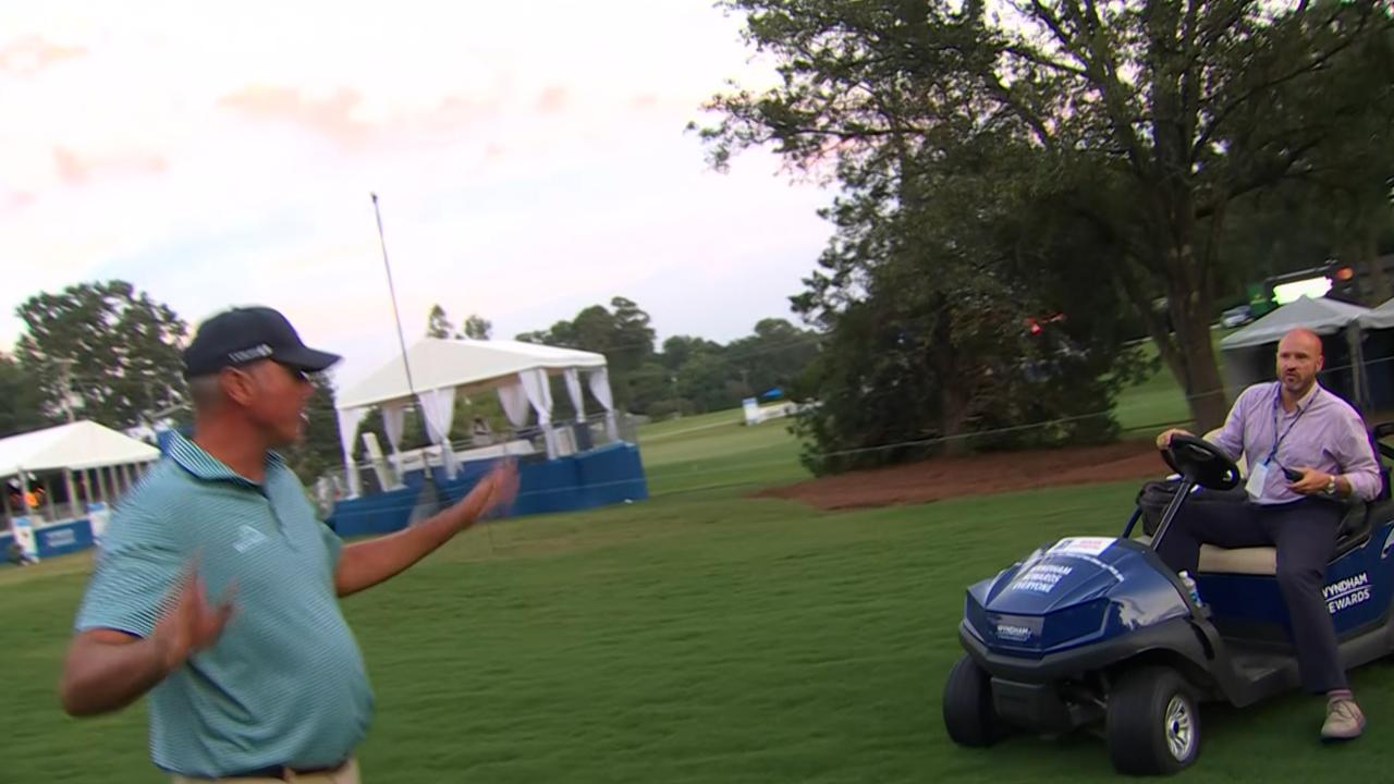 Matt Kuchar abandons his round while talking to a PGA official.