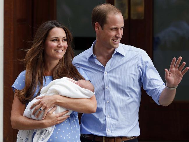 The Duchess of Cambridge, left, cradles her newborn son Prince George in 2013, outside St. Mary's Hospital’s Lindo Wing with Prince William (right). Picture: AP Photo/Lefteris Pitarakis