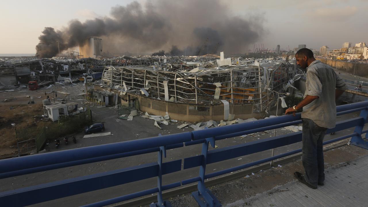 A man surveys destroyed buildings. Picture: Getty Images