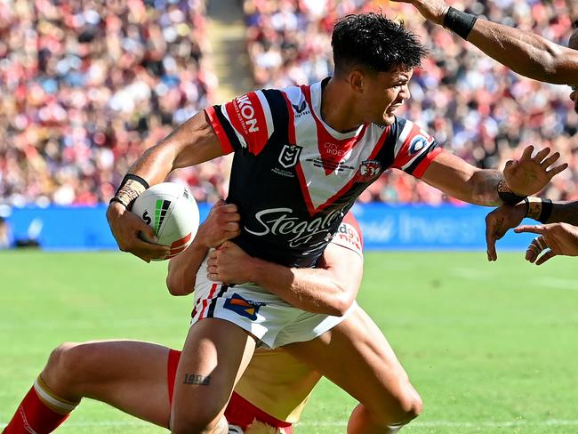 BRISBANE, AUSTRALIA - MARCH 05: Jaxson Paulo of the Roosters is tackled during the round one NRL match between the Dolphins and Sydney Roosters at Suncorp Stadium on March 05, 2023 in Brisbane, Australia. (Photo by Bradley Kanaris/Getty Images)