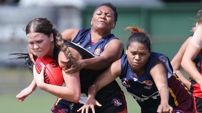 Saints' Grace Perry is tackled in the Cairns Women's match between the Cairns Saints and the Cairns City Lions, held at Griffiths Park, Manunda. Picture: Brendan Radke