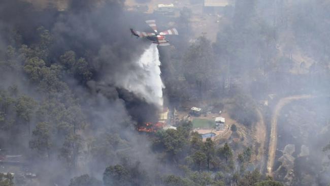 Aerial vision shows several homes in the area were in the immediate path of the blaze. Picture: 9 News