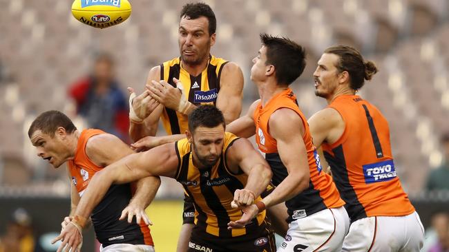 Hawthorn’s Jonathon Ceglar attempts to mark the ball over teammate Jack Gunston and Giants players Heath Shaw, Sam Taylor  and Phil Davis. Picture: AFL Photos