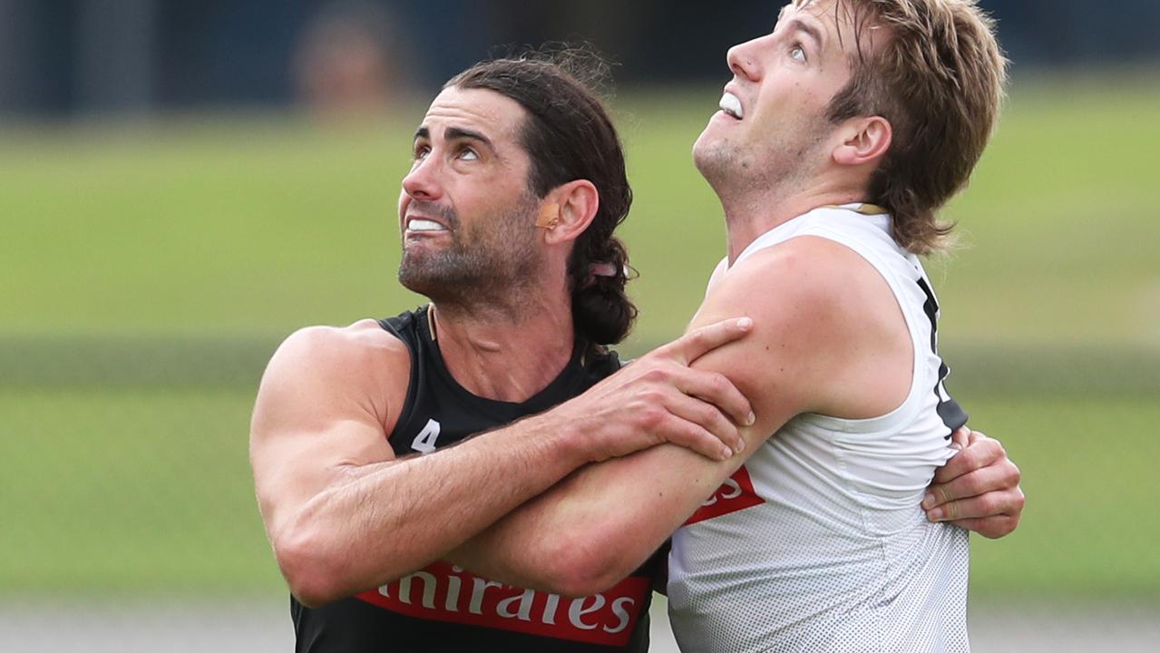 Brodie Grundy (left) works on his ruck craft at pre-season training.