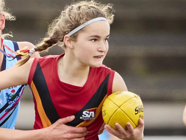 Quin Neyland and Brooke Weatherald in the match between SA and NSW at Norwood Oval, at the U12 Girls Australian Football Championships, Sunday, Aug. 7, 2022. Picture: MATT LOXTON