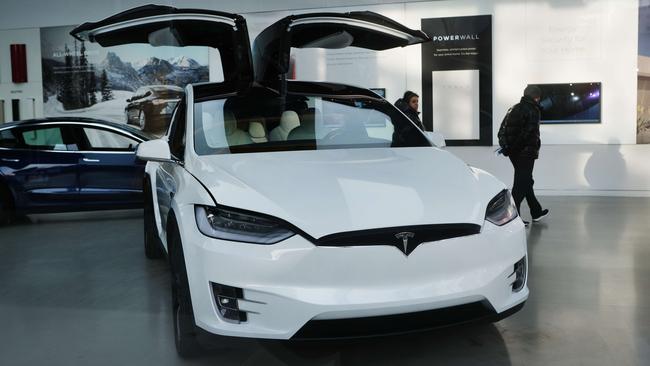 A tesla electric vehicle is displayed in a Manhattan dealership. Spencer Platt/Getty Images/AFP