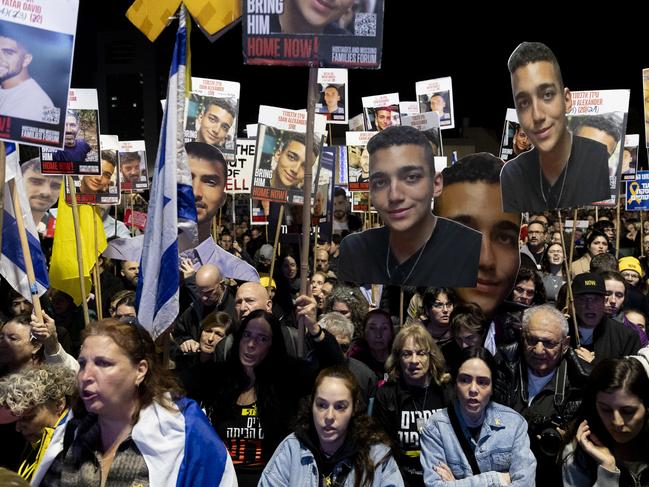 TEL AVIV, ISRAEL - MARCH 1: Protesters hold photos of hostages held by Hamas in the Gaza Strip during a demonstration calling for the release of all hostages on March 1, 2025 in Tel Aviv, Israel. The first phase of the Israel-Hamas ceasefire ended earlier this week, but negotiations on the second phase, which would bring the release of further hostages, have not yet begun. (Photo by Amir Levy/Getty Images)