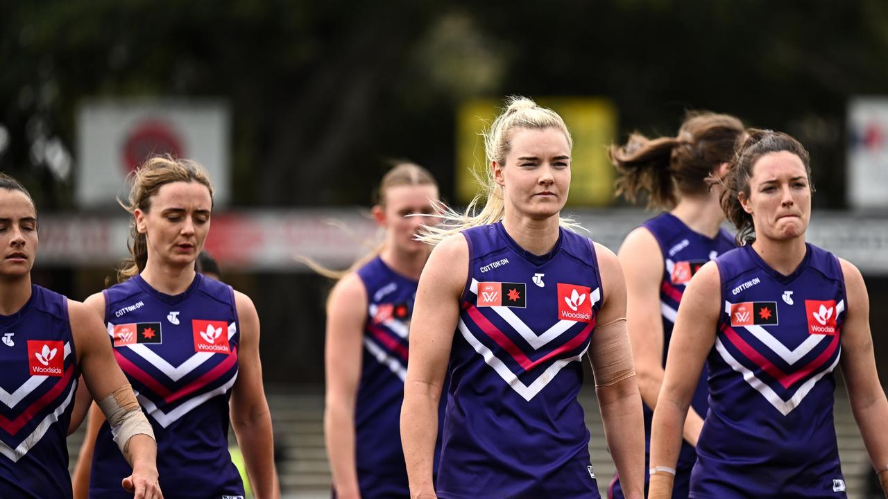 Hayley Miller and her Dockers teammates after failing to kick a goal against Geelong.