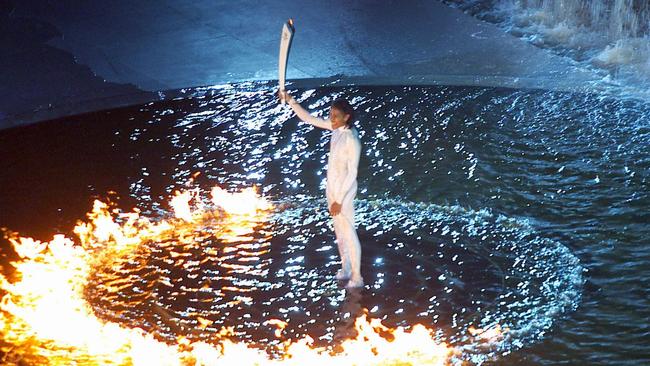 Queensland legend Catherine Freeman lights the cauldron at the 2000 Sydney Olympics, which provided a tourism boost for Queensland