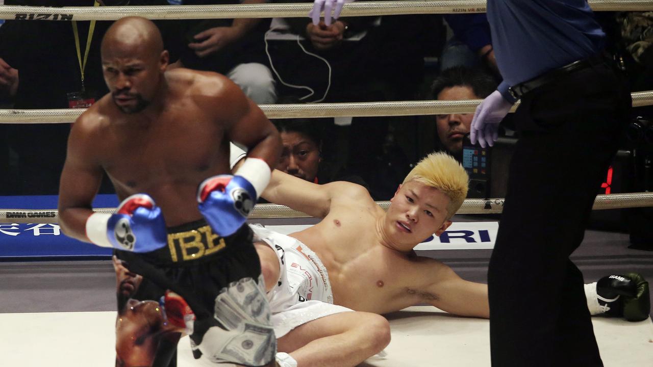 Japanese kickboxer Tenshin Nasukawa lies on the mat after being knocked down by Floyd Mayweather Jr.