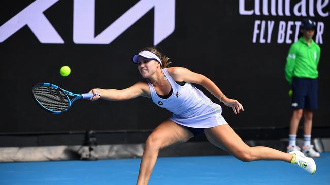 Sofia Kenin of the US hits a return against Estonia's Kaia Kanepi during their women's singles match on day four of the Australian Open tennis tournament in Melbourne on February 11, 2021. (Photo by William WEST / AFP) / — IMAGE RESTRICTED TO EDITORIAL USE – STRICTLY NO COMMERCIAL USE —