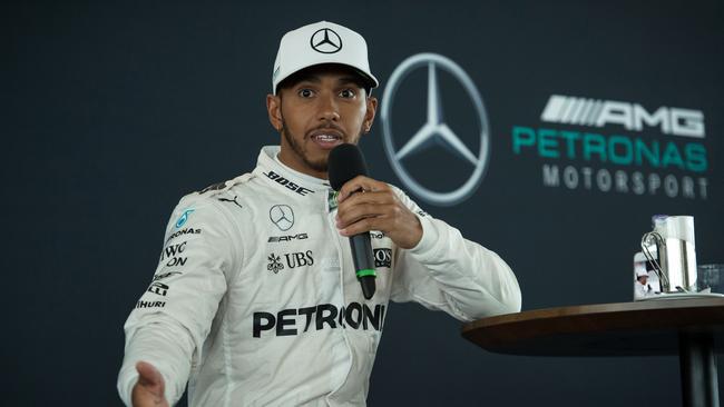 Mercedes AMG Petronas Formula One driver Britain's Lewis Hamilton speaks during a launch event for the Mercedes 2017 Formula one car at Silverstone motor racing circuit near Towcester, central England on February 23, 2017. / AFP PHOTO / OLI SCARFF