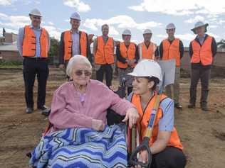 SHOVEL READY: Whiddon Group Grafton’s oldest resident Maisie McLean, aged 105, and the facility’s employee of the year Sherrie-Lee Rediger look over the building site with executives and developers. Photo: Adam Hourigan